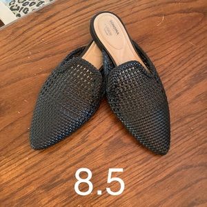 Black pointed-toe slip-on flats